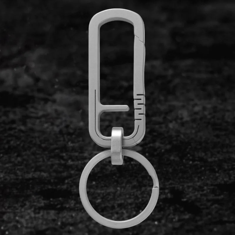 Close-up of titanium carabiner keychain with ring attachment
