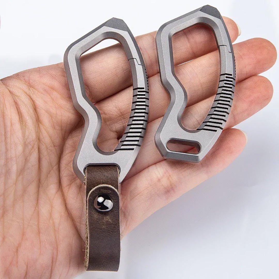 Two titanium carabiners side by side showing brushed finish