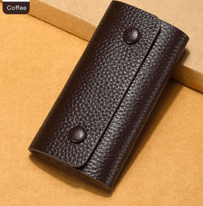 Coffee colored leather wallet on a beige background
