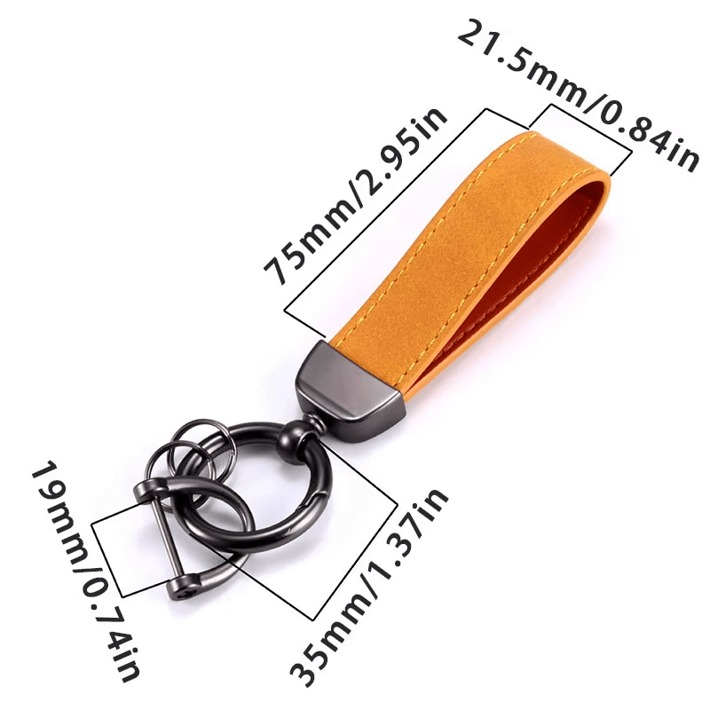 Orange leather keychain with measurements on a white background