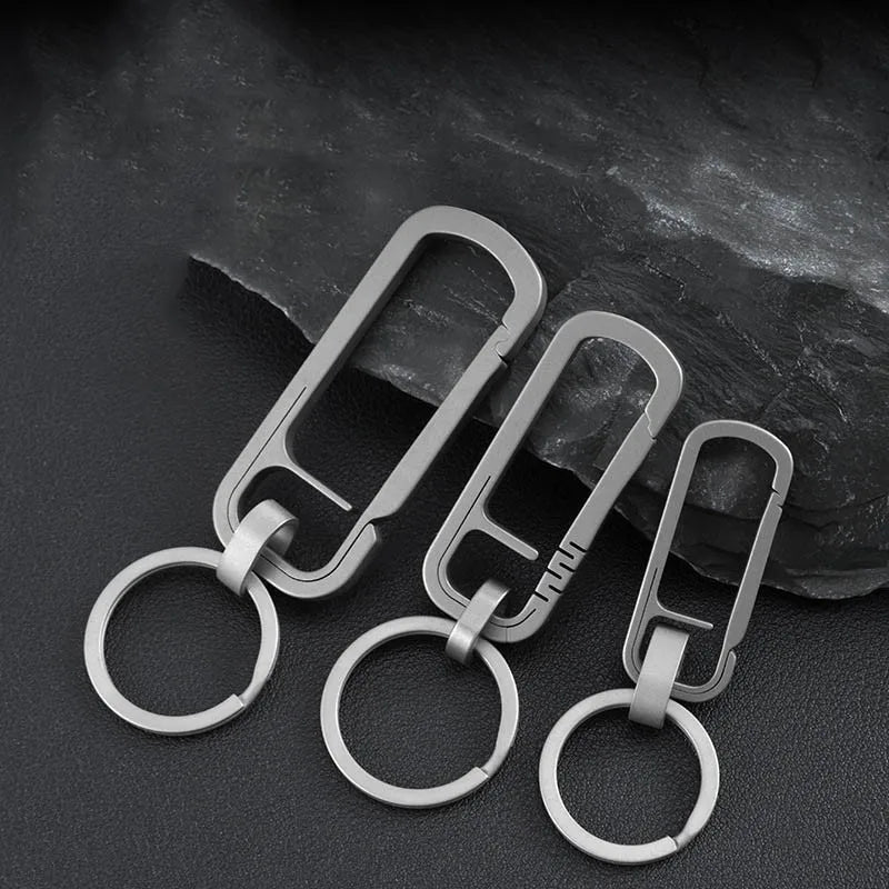 Set of three titanium alloy carabiners in different sizes