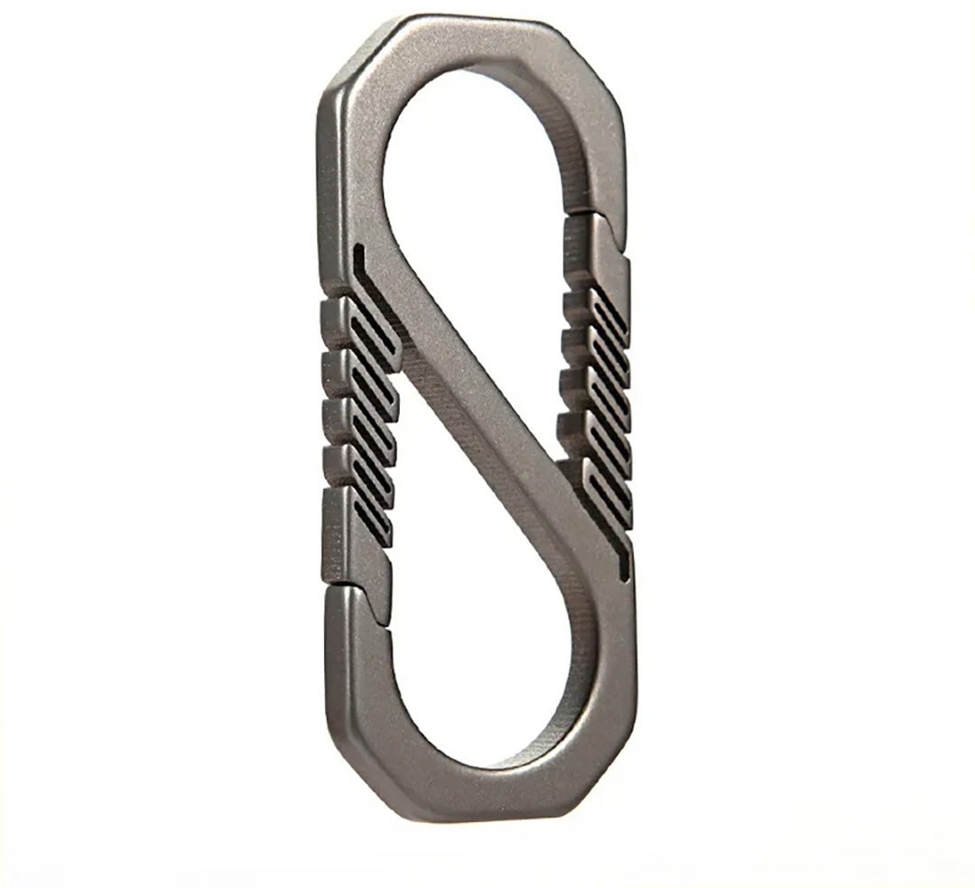 Metallic carabiner on a white background