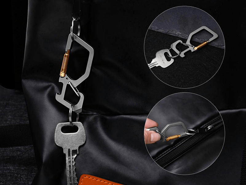 Titanium Alloy Carabiner Clip Keychain with Gold Accent functions.