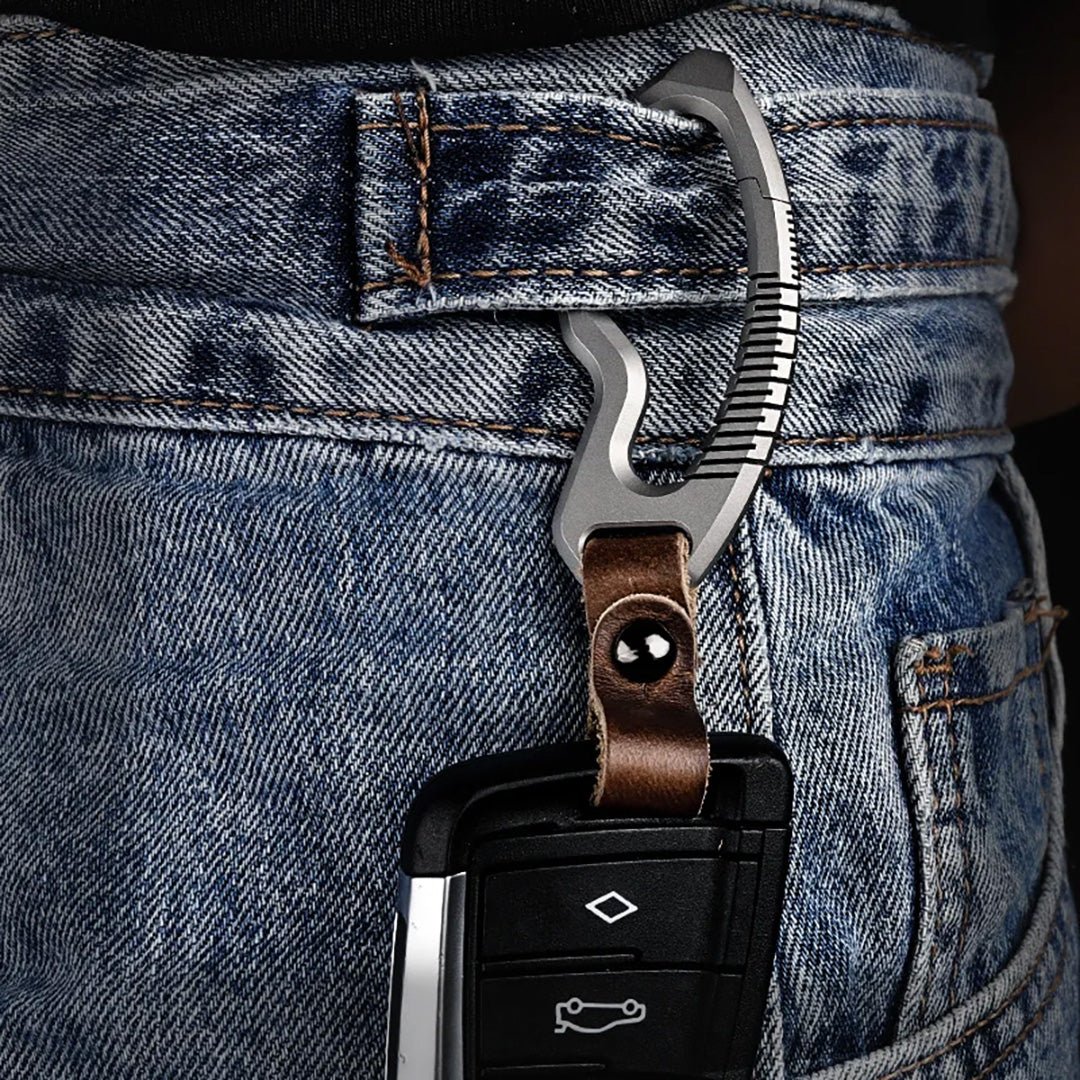Titanium carabiner keychain with leather strap attached to jeans belt loop