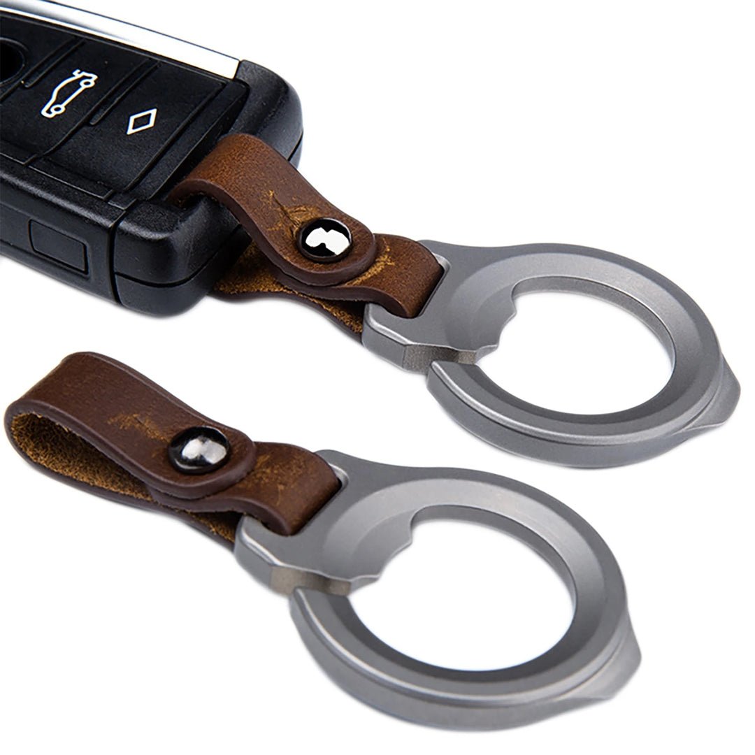 Keychain with bottle opener and car key fob on a white background