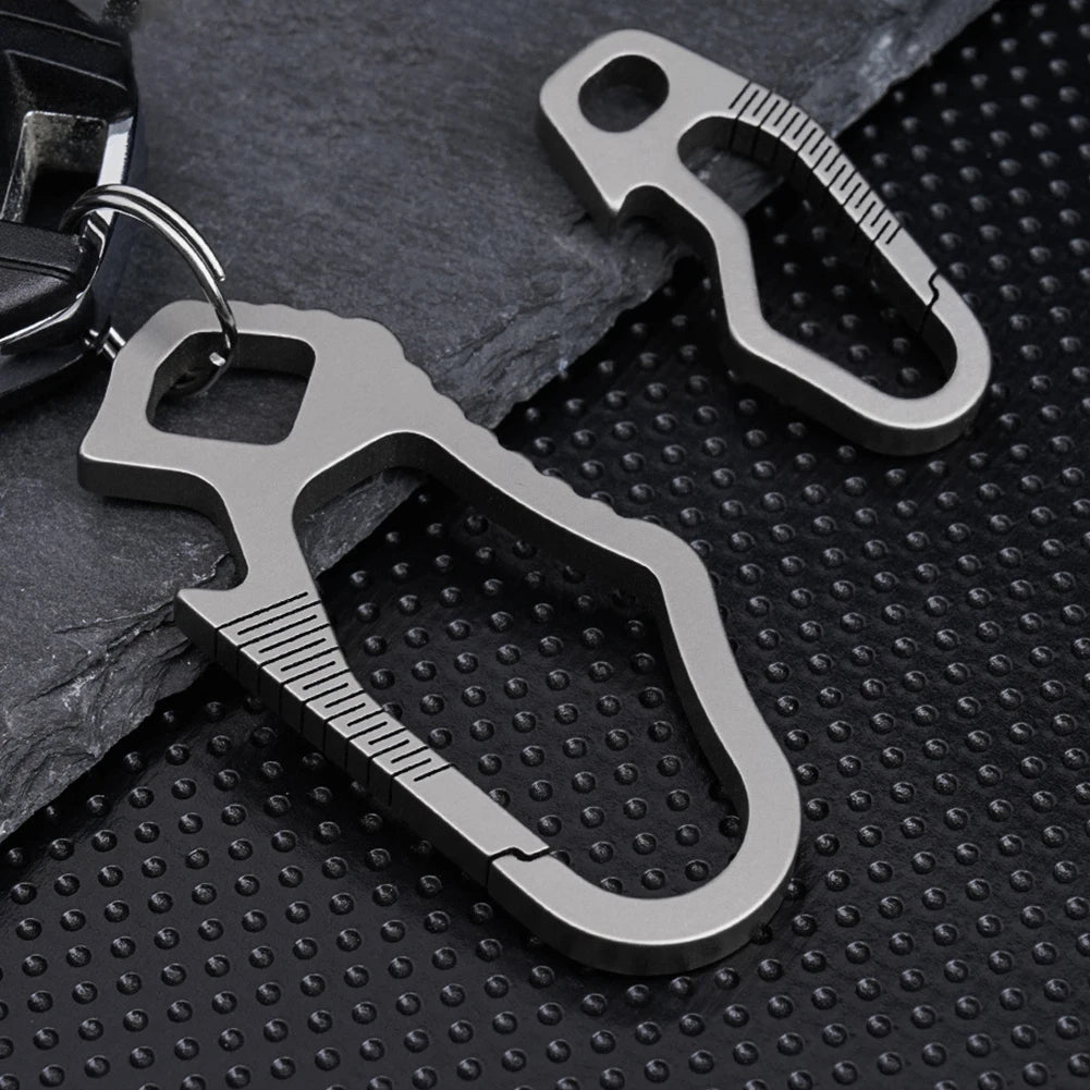 Titanium carabiners shown in small and large versions on dark background