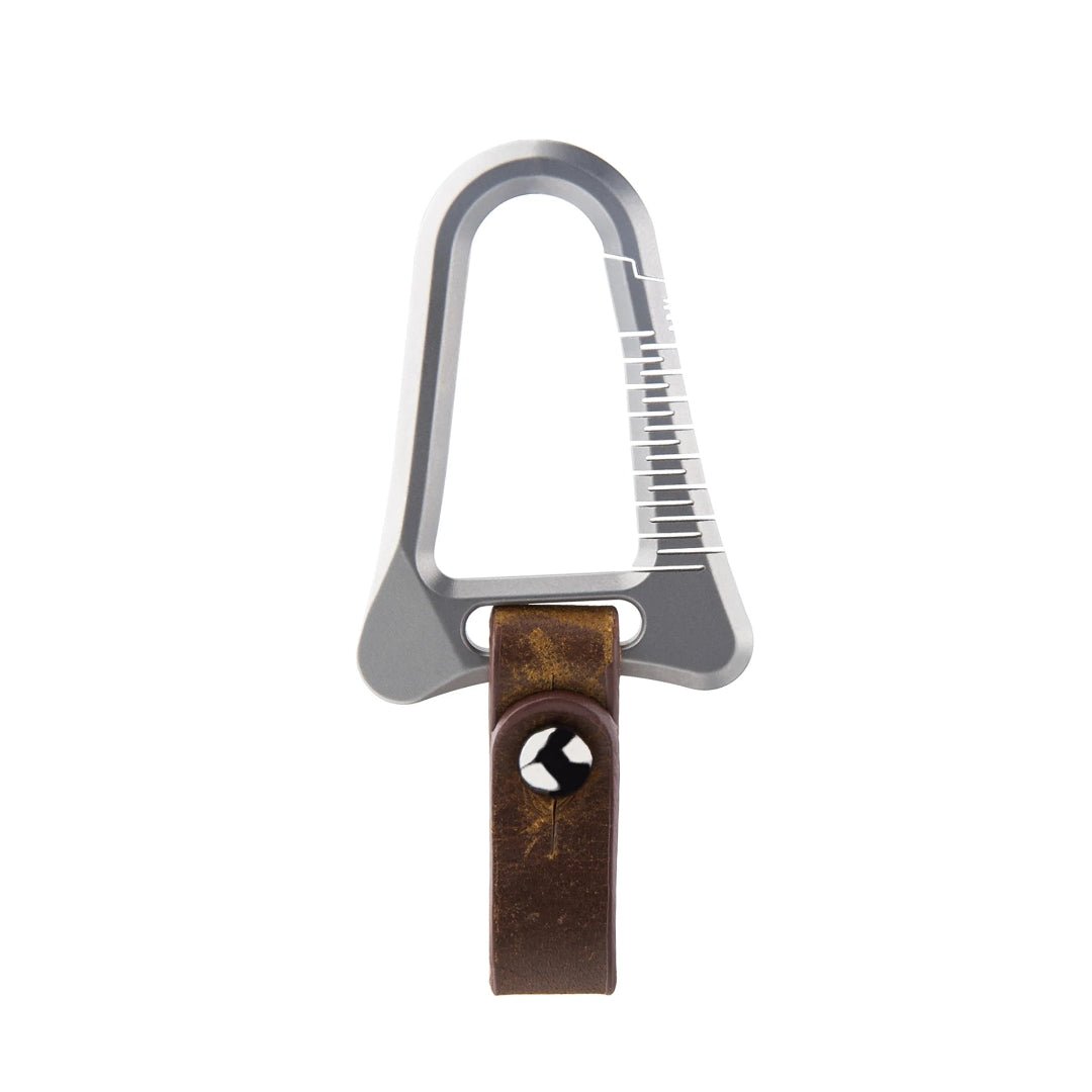 Carabiner with a leather strap and metal clip on a white background