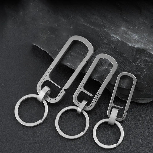 Set of three titanium alloy carabiners in different sizes