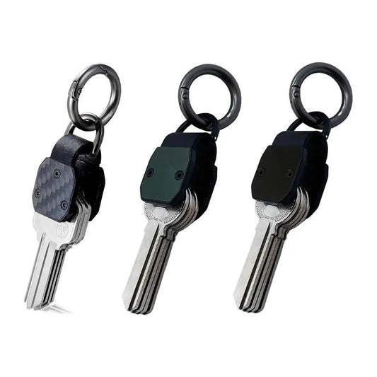 Three keychains with keys on a white background