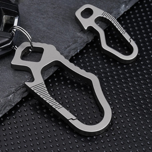 Titanium carabiners shown in small and large versions on dark background